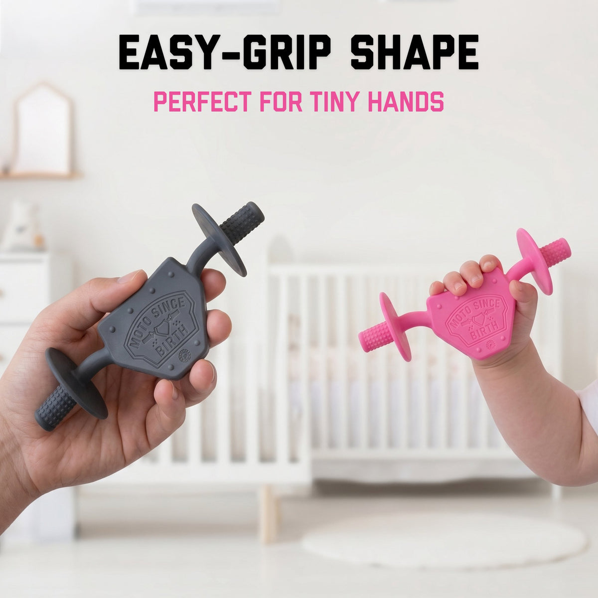 Adult hand and baby hand holding Moto Since Birth teethers, showing the size difference