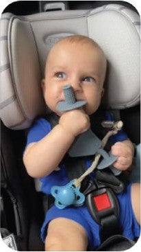 Baby in a car seat chewing the grey Moto Since Birth teether